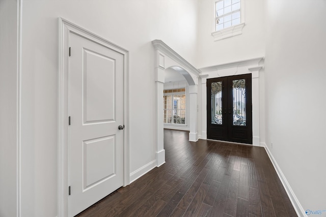 entryway featuring french doors and dark wood-type flooring