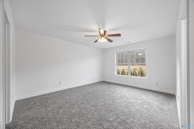 carpeted empty room featuring ceiling fan