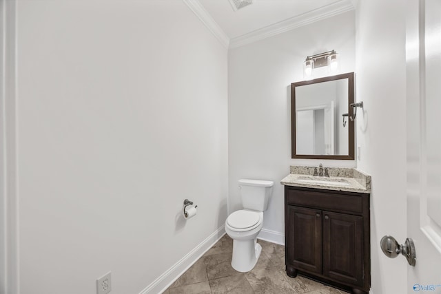 bathroom featuring ornamental molding, vanity, and toilet