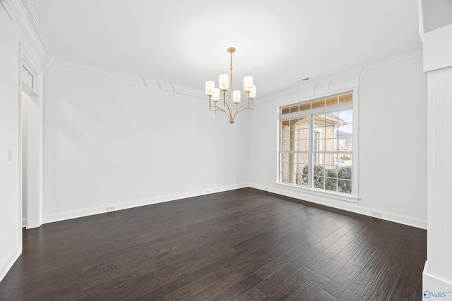 empty room with ornamental molding, dark hardwood / wood-style floors, and a notable chandelier