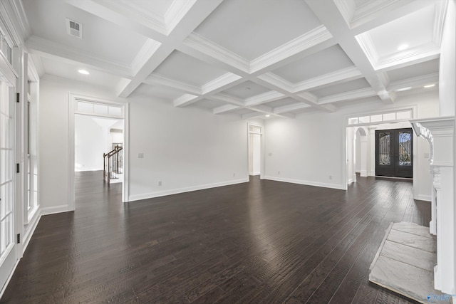 unfurnished living room featuring dark wood-type flooring, coffered ceiling, ornamental molding, french doors, and beamed ceiling