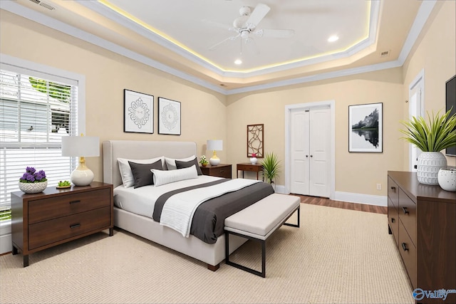 505 Barkley St SW, Hartselle, AL 35640 - bedroom with light wood-style floors, baseboards, a raised ceiling, recessed lighting, and a closet