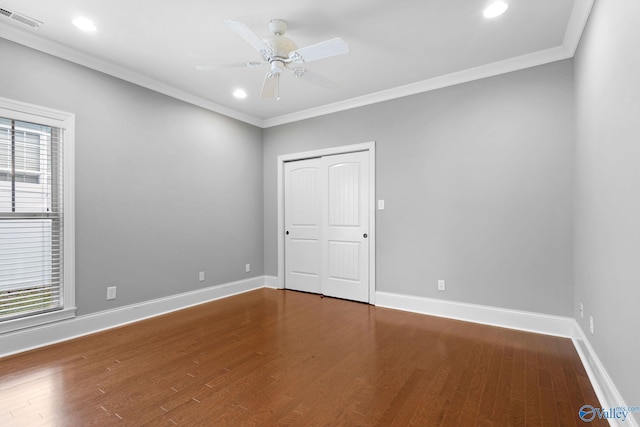 505 Barkley St SW, Hartselle, AL 35640 - unfurnished bedroom featuring ornamental molding, wood finished floors, multiple windows, baseboards, and recessed lighting
