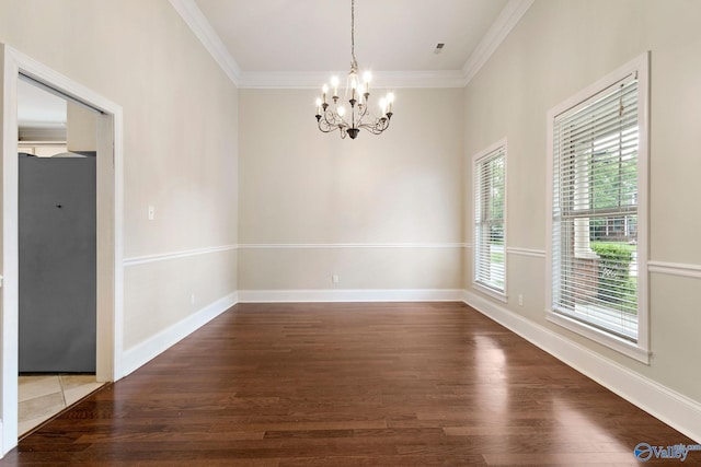 505 Barkley St SW, Hartselle, AL 35640 - empty room featuring a chandelier, wood finished floors, crown molding, and baseboards