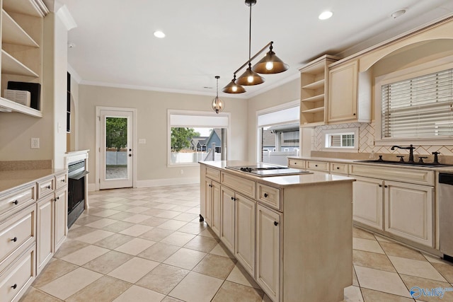 505 Barkley St SW, Hartselle, AL 35640 - kitchen with open shelves, cream cabinetry, appliances with stainless steel finishes, a sink, and tasteful backsplash