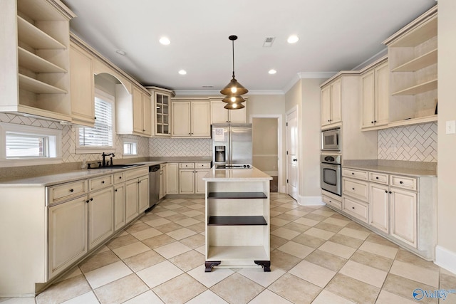 505 Barkley St SW, Hartselle, AL 35640 - kitchen with open shelves, cream cabinets, stainless steel appliances, tasteful backsplash, and recessed lighting