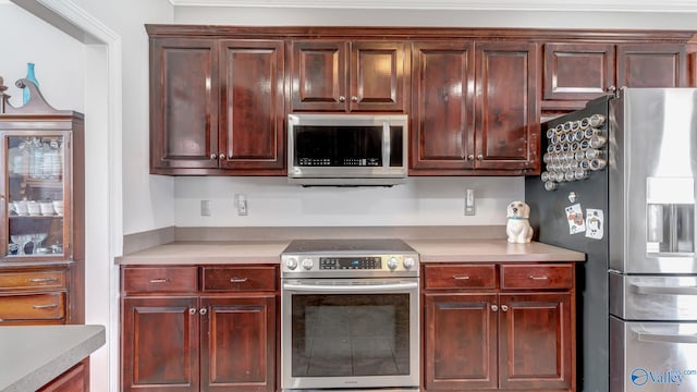kitchen featuring appliances with stainless steel finishes and light countertops
