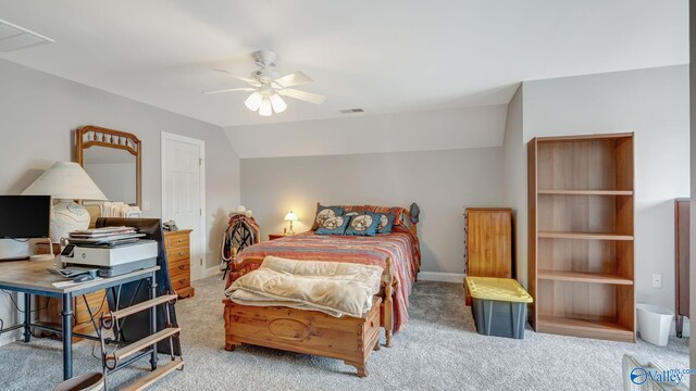 bedroom with lofted ceiling, carpet, visible vents, and baseboards