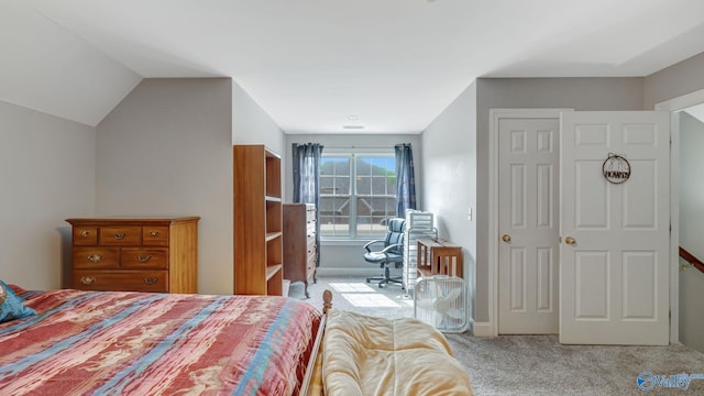 carpeted bedroom featuring baseboards