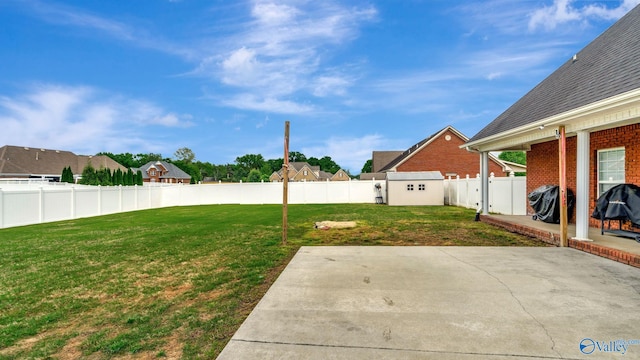view of yard featuring a patio area and a fenced backyard