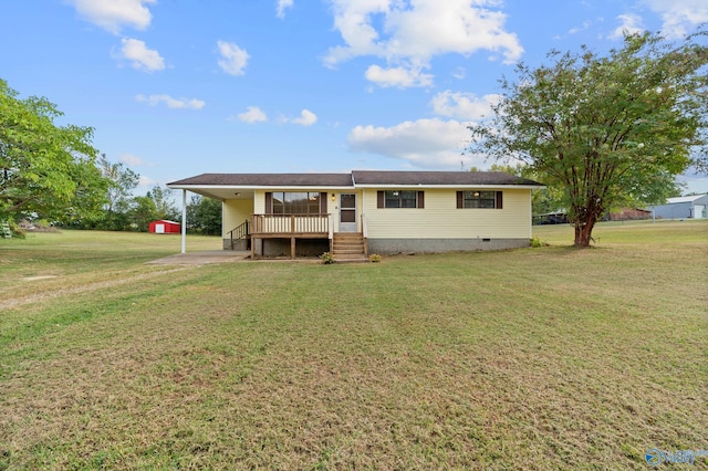 view of front of property with a wooden deck, a front lawn, and a carport