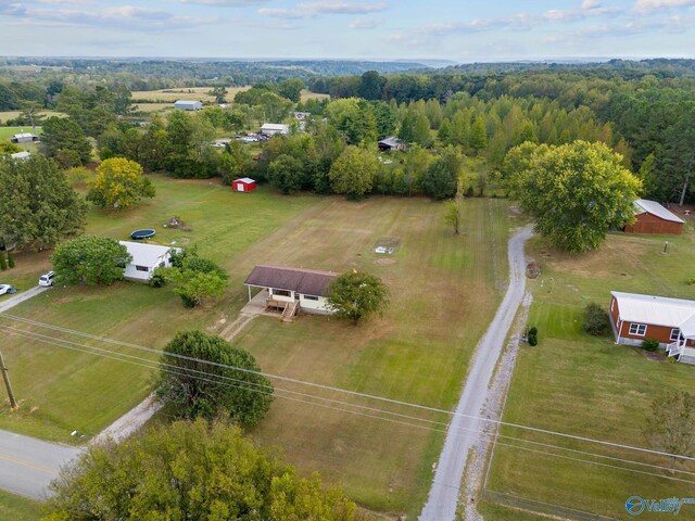 birds eye view of property with a rural view