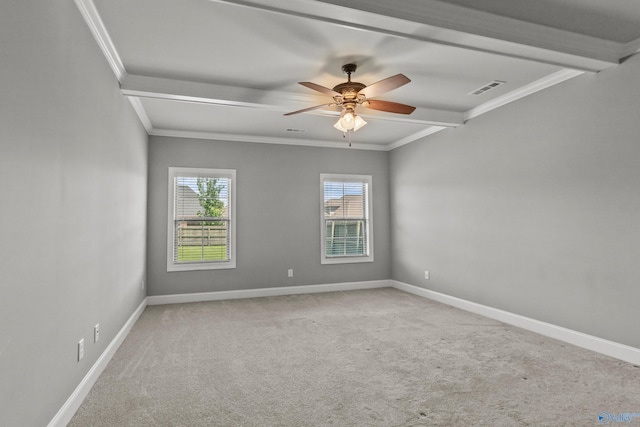 empty room with carpet, a ceiling fan, baseboards, and crown molding