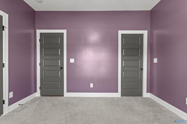 spare room with carpet flooring and baseboards