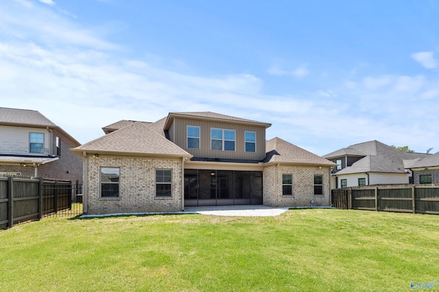 back of house featuring brick siding, a patio, and a sunroom