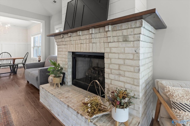111 Starling Dr, Madison, AL 35756 - details with a fireplace, wood finished floors, ornamental molding, and wainscoting