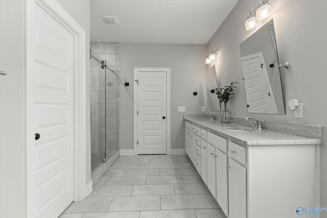 111 Starling Dr, Madison, AL 35756 - bathroom with double vanity, a sink, and a shower stall