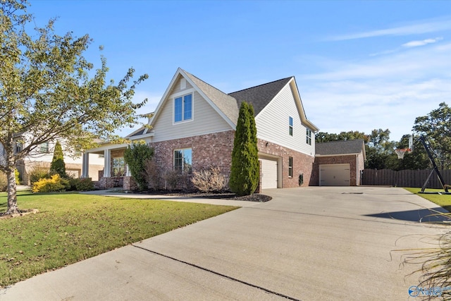 111 Starling Dr, Madison, AL 35756 - view of home's exterior with a lawn, brick siding, concrete driveway, an attached garage, and fence