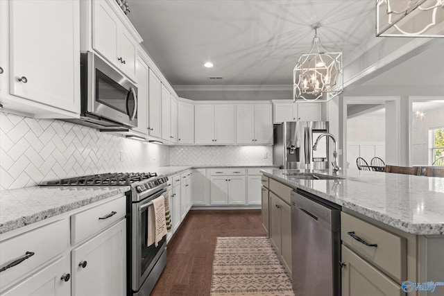 111 Starling Dr, Madison, AL 35756 - kitchen featuring a sink, a chandelier, stainless steel appliances, dark wood finished floors, and a center island with sink