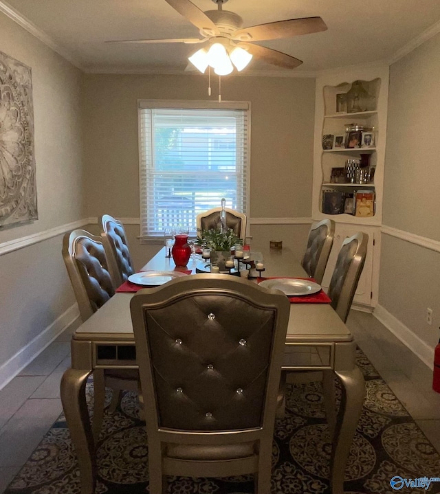 tiled dining area with crown molding and ceiling fan