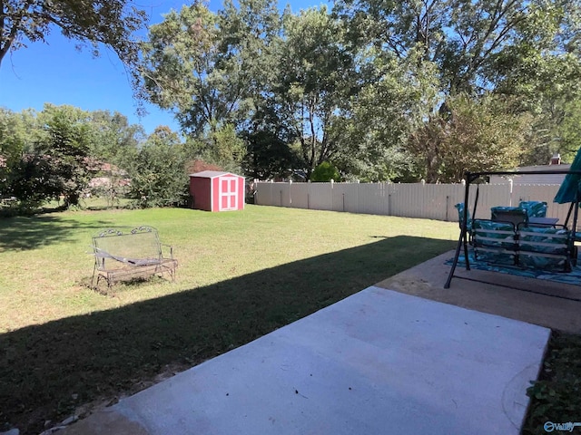 view of yard with a patio area and a shed