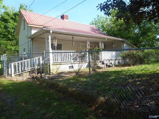 2308 County Road 458, Fort Payne, AL 35968 - back of house with a porch, a chimney, fence, and metal roof