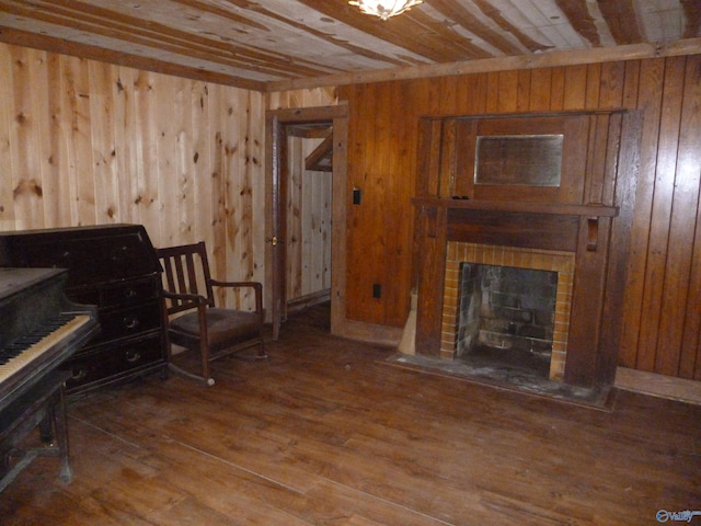 2308 County Road 458, Fort Payne, AL 35968 - sitting room featuring wood ceiling, wooden walls, wood finished floors, and a brick fireplace