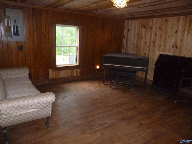 2308 County Road 458, Fort Payne, AL 35968 - sitting room featuring wood ceiling, electric panel, wooden walls, wood finished floors, and radiator
