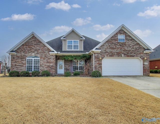 view of front property featuring a garage and a front yard