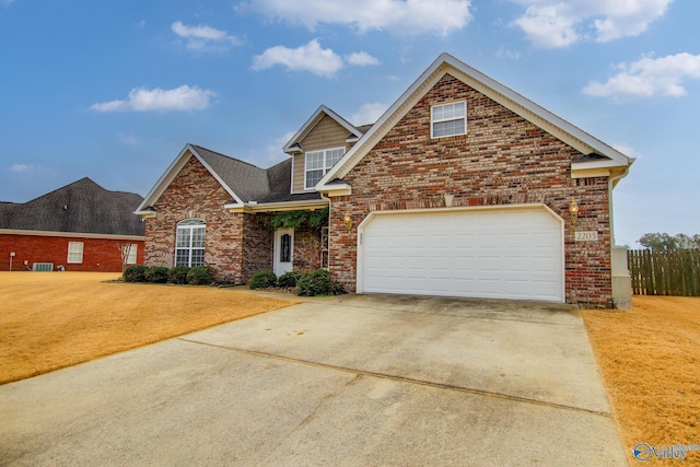 front of property featuring cooling unit, a garage, and a front lawn