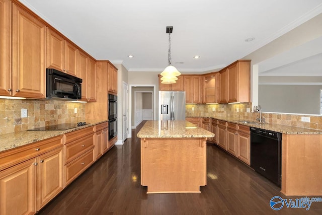 kitchen with dark wood-type flooring, black appliances, ornamental molding, a sink, and light stone counters