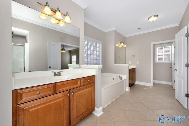 bathroom featuring tile patterned floors, two vanities, a wealth of natural light, and a sink