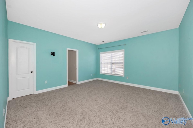 unfurnished bedroom featuring visible vents, baseboards, and carpet flooring