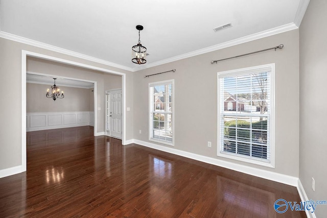 interior space featuring crown molding, a notable chandelier, wood finished floors, and visible vents