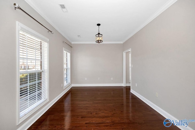 unfurnished dining area with visible vents, baseboards, wood finished floors, and crown molding