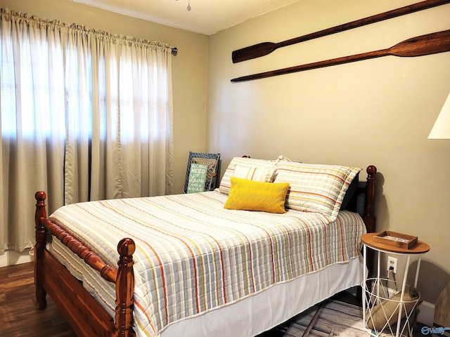 bedroom with wood finished floors