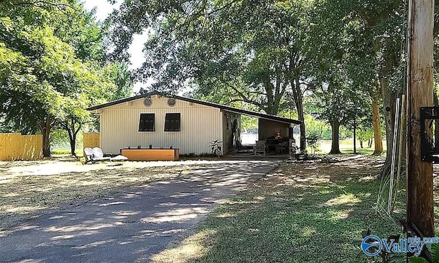 view of front facade with driveway and an attached carport