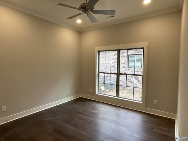 unfurnished room with crown molding, ceiling fan, and dark hardwood / wood-style flooring