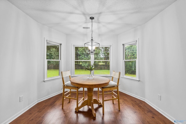138 Spring Farm Rd, Huntsville, AL 35811 - dining area featuring a chandelier, dark wood-style floors, and a textured ceiling