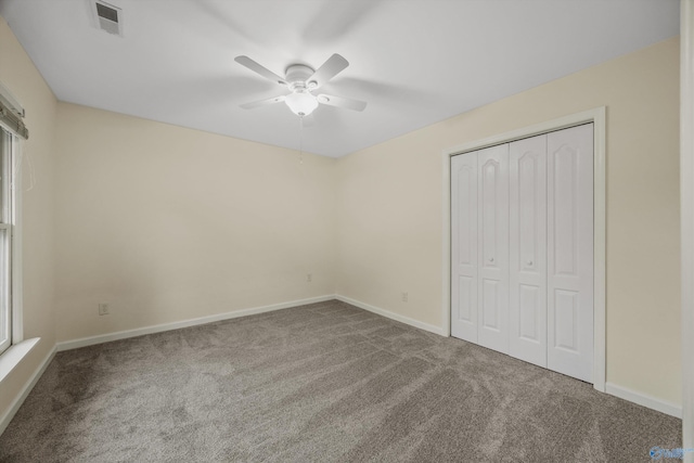 138 Spring Farm Rd, Huntsville, AL 35811 - unfurnished bedroom featuring carpet flooring, a closet, and a ceiling fan