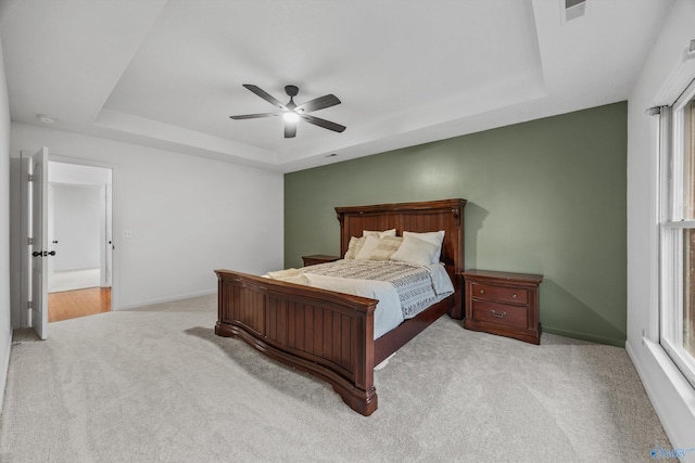 138 Spring Farm Rd, Huntsville, AL 35811 - bedroom featuring a tray ceiling, carpet floors, multiple windows, and ceiling fan