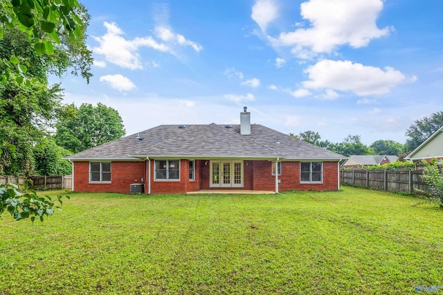 138 Spring Farm Rd, Huntsville, AL 35811 - rear view of house featuring french doors, a fenced backyard, a chimney, and brick siding