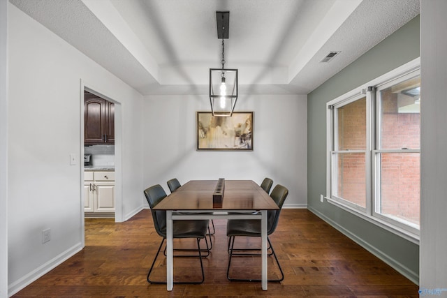 138 Spring Farm Rd, Huntsville, AL 35811 - dining area featuring dark wood finished floors and a tray ceiling