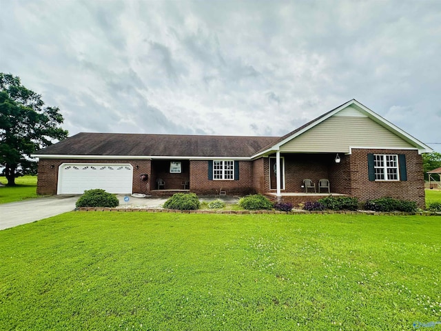 175 County Road 23, Leesburg, AL 35983 - ranch-style home featuring brick siding, an attached garage, a front lawn, and concrete driveway