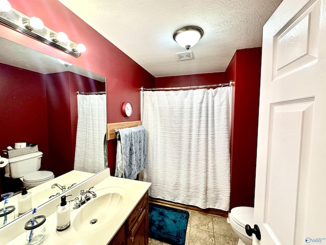 175 County Road 23, Leesburg, AL 35983 - bathroom with toilet, vanity, a shower with shower curtain, a textured ceiling, and tile patterned flooring