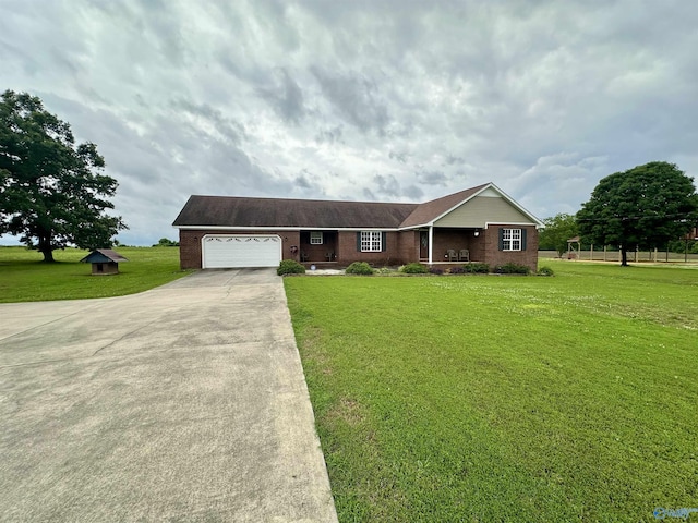 175 County Road 23, Leesburg, AL 35983 - ranch-style home featuring driveway, an attached garage, a front lawn, and brick siding