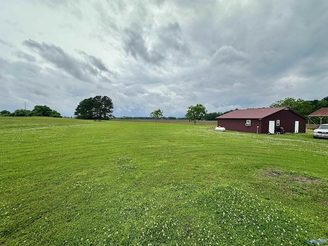 175 County Road 23, Leesburg, AL 35983 - view of grassy yard featuring a pole building and an outbuilding