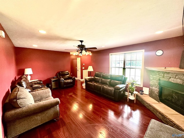 175 County Road 23, Leesburg, AL 35983 - living room featuring a stone fireplace, hardwood / wood-style floors, a ceiling fan, and recessed lighting