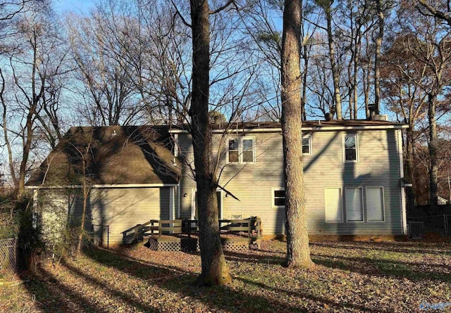 view of home's exterior featuring central AC unit and a wooden deck