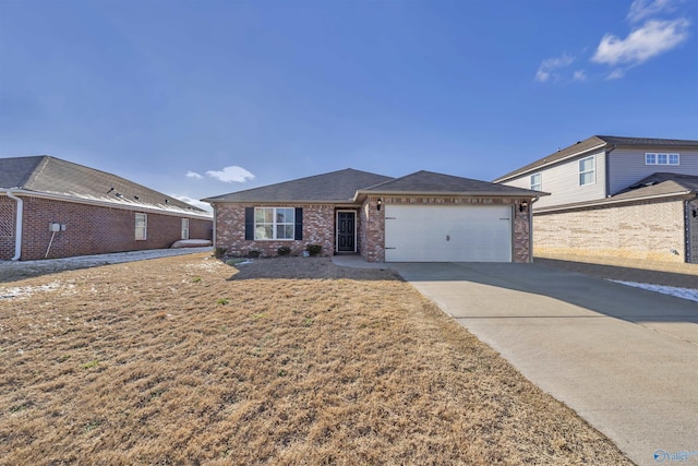 ranch-style house with a garage, roof with shingles, concrete driveway, and brick siding